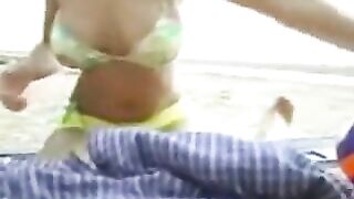 Busty Blonde Gives Hung Guy Handjob On Beach