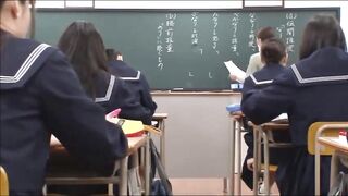Japanese Teacher Gives A Valuable Lesson At The Blackboard